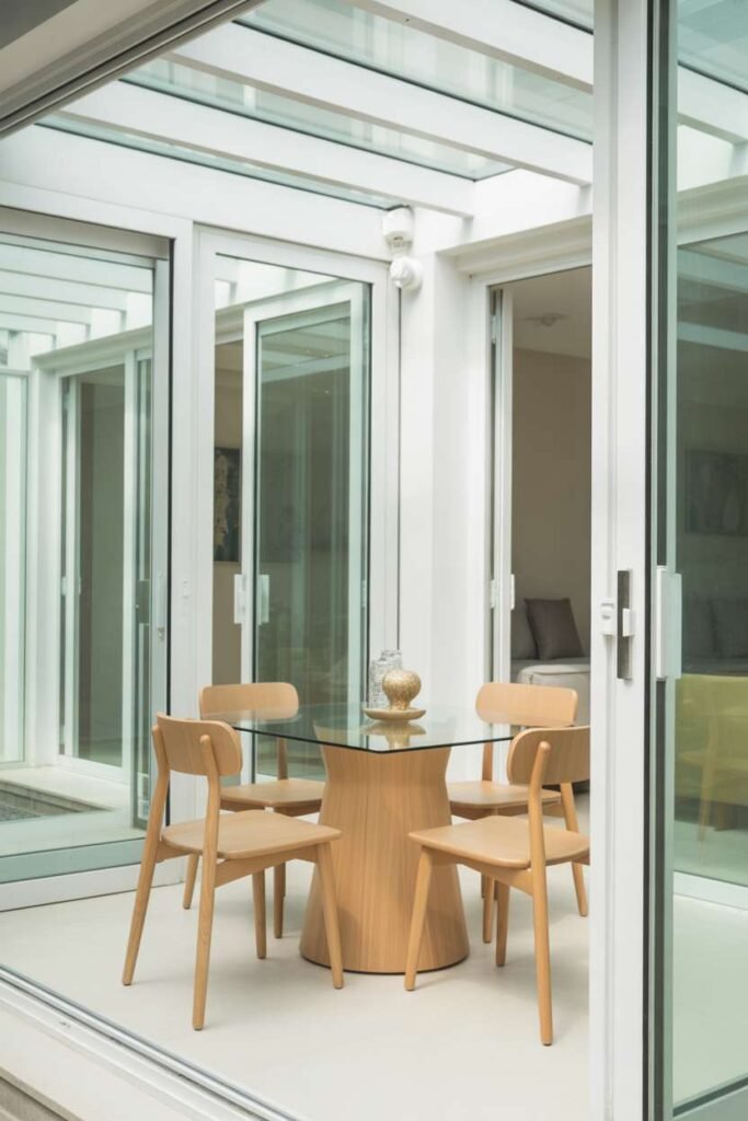  Glass Table with Light Wood Accents